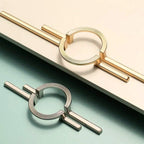 Tirador largo con anilla para armarios y muebles – dorado o cromo – diseño escultórico – 96 o 256 mm
